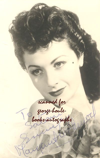 length portrait of Margaret Lockwood wearing a low cut gown 