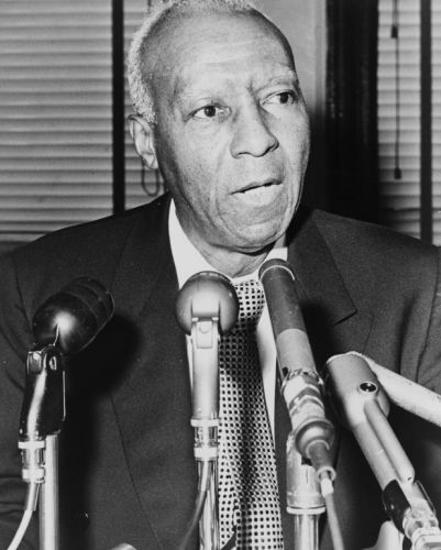 1964 photo Asa Philip Randolph, behind microphones  