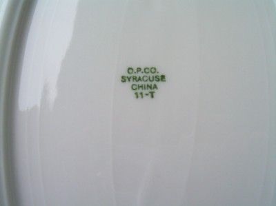 This is a vintage O.P.CO. Syracuse China, oval dish with a date stamp 