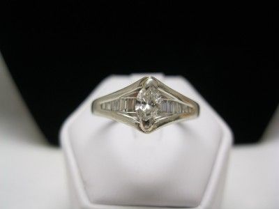 PLATINUM MARQUISE & BAGUETTE DIAMOND SOLITAIRE RING  