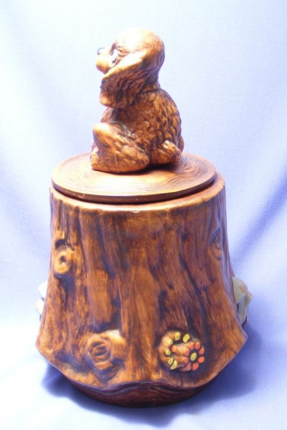 PUPPY ON A TREE STUMP COOKIE JAR WITH NUMBER IN LID.  